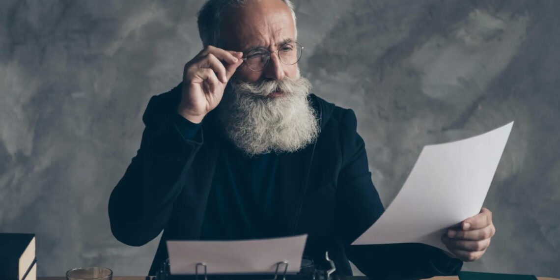 Professor Examining Paper