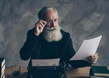 Professor Examining Paper